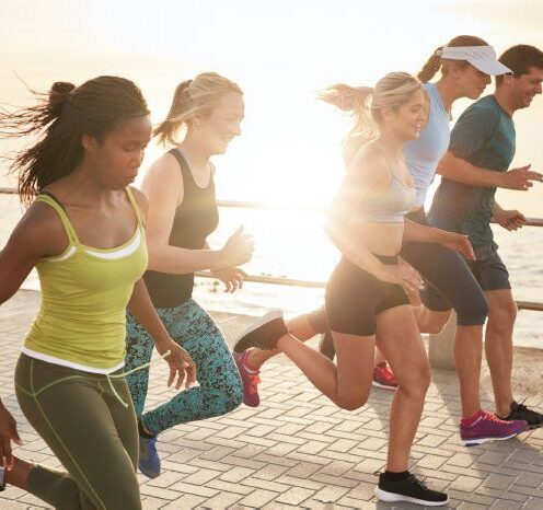 Runners on waterside path